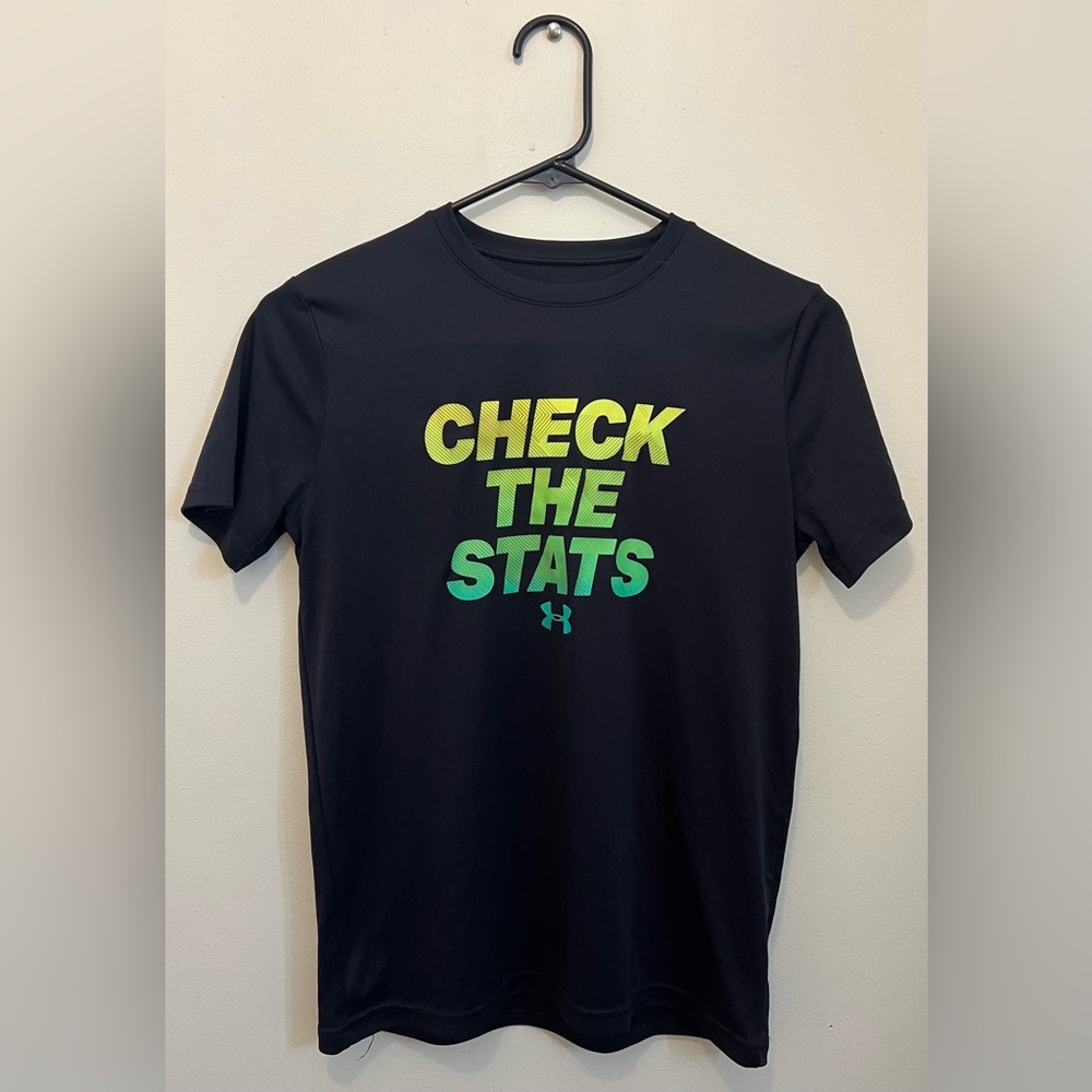 Under Armour Tshirt. Black with check the stats words. Size youth medium.